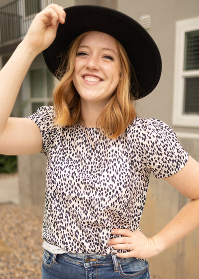 Ivory top with short sleeves and small black print