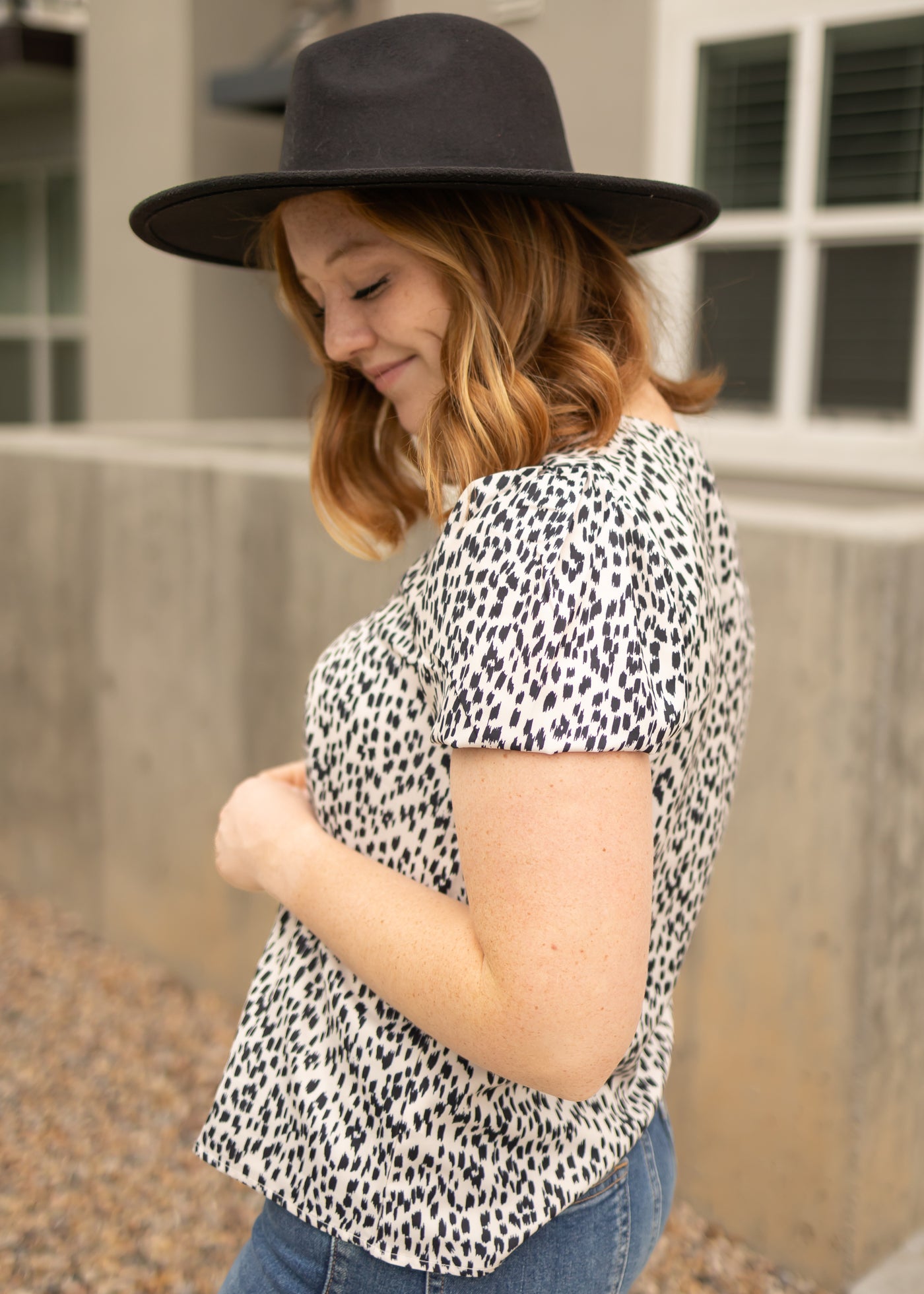 Side view of a short sleeve ivory top