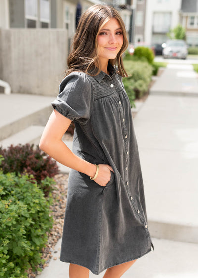 Side view of the black button down dress