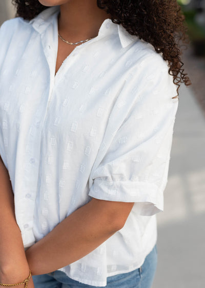 Close up of the fabric on the lined white button down top