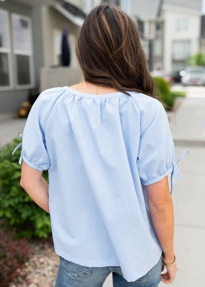 Back view of the blue mini checkered top