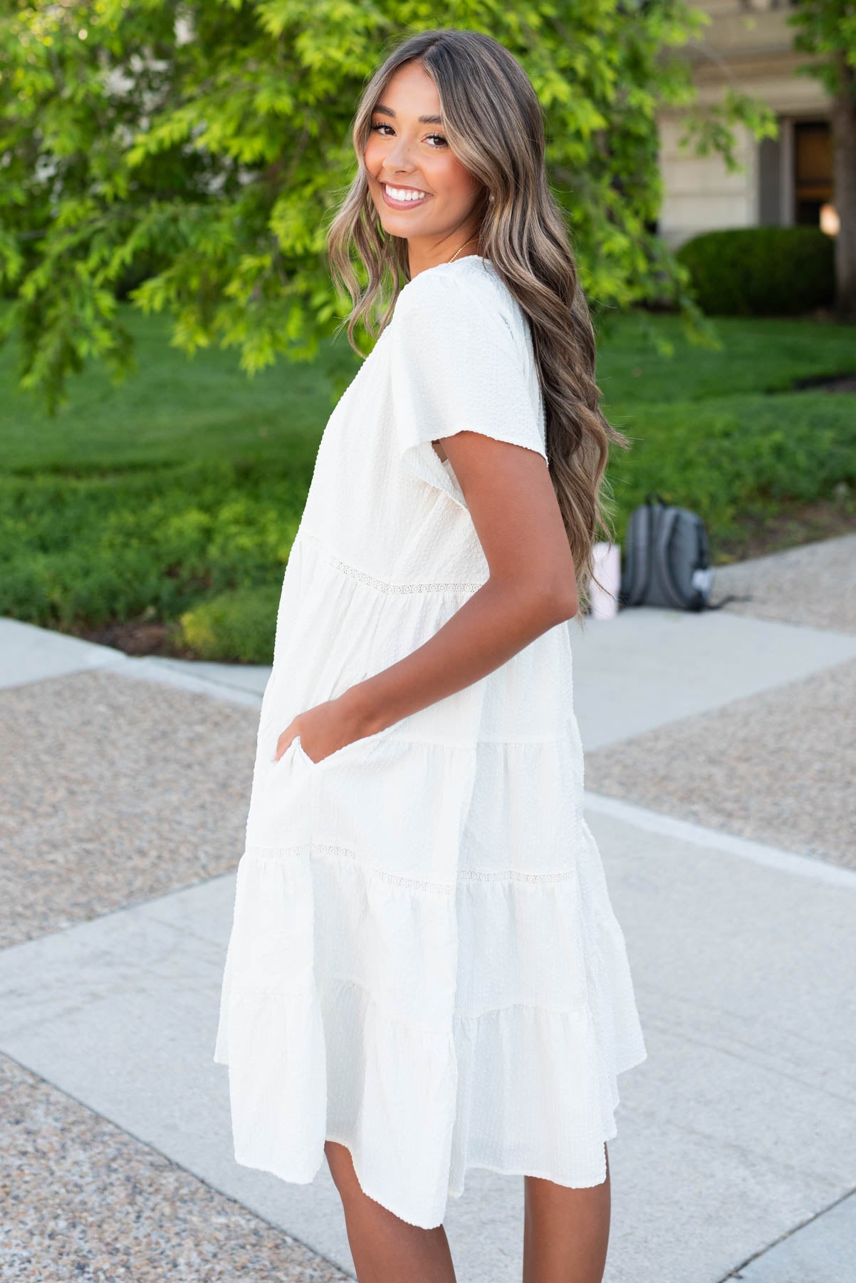 Side view of the ivory tiered dress