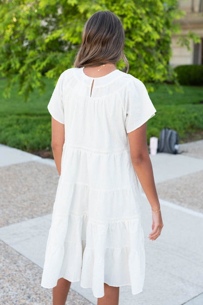 Back view of the ivory tiered dress with keyhole closer in the back