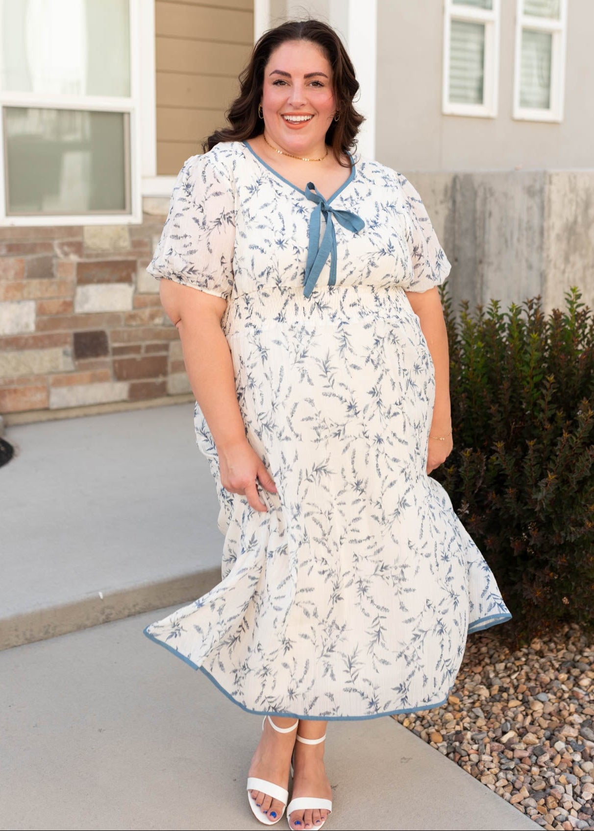 Plus size cream floral dress with a modest v-neckline