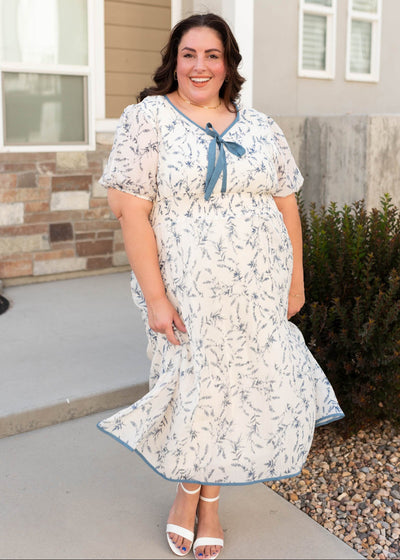 Plus size cream floral dress with a modest v-neckline