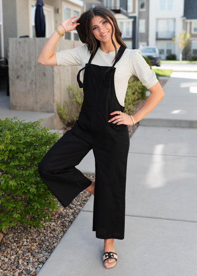 Black knot strap overall with front pockets