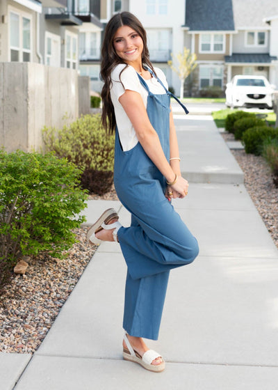 Side view of the dusty blue knot strap overall