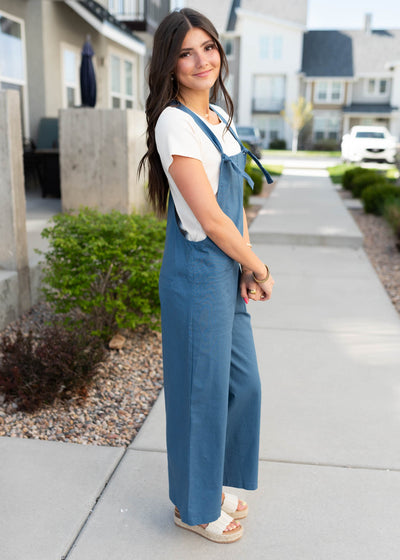 Side view of the dusty blue knot strap overall