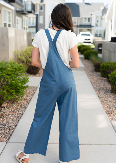 Back view of the dusty blue knot strap overall