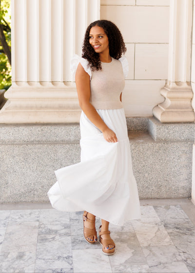 White sweater vest dress with ruffles on the cuff