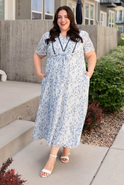 Plus size blue floral dress with tie at the waist