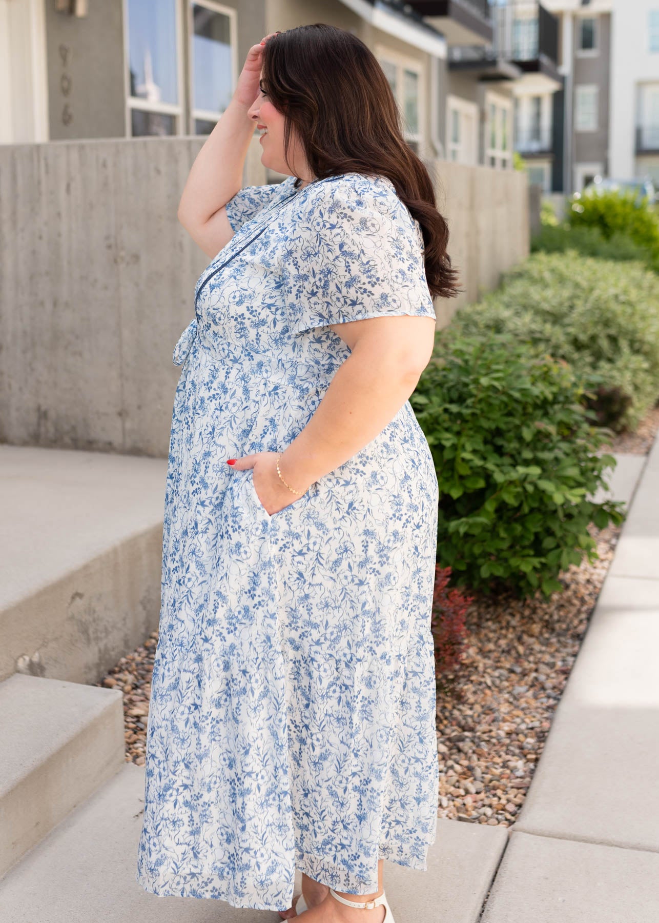 Side view of the plus size blue floral dress