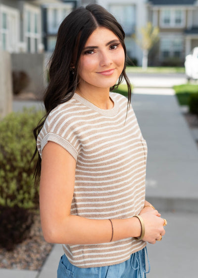 Side view of the light brown striped knitted top