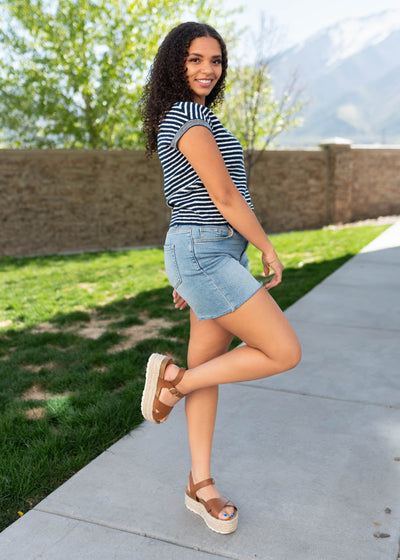 Side view of the navy striped top with short sleeves