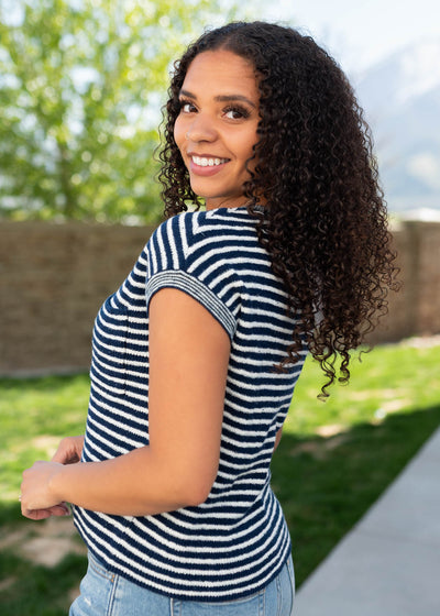 Side view of the navy striped knitted top