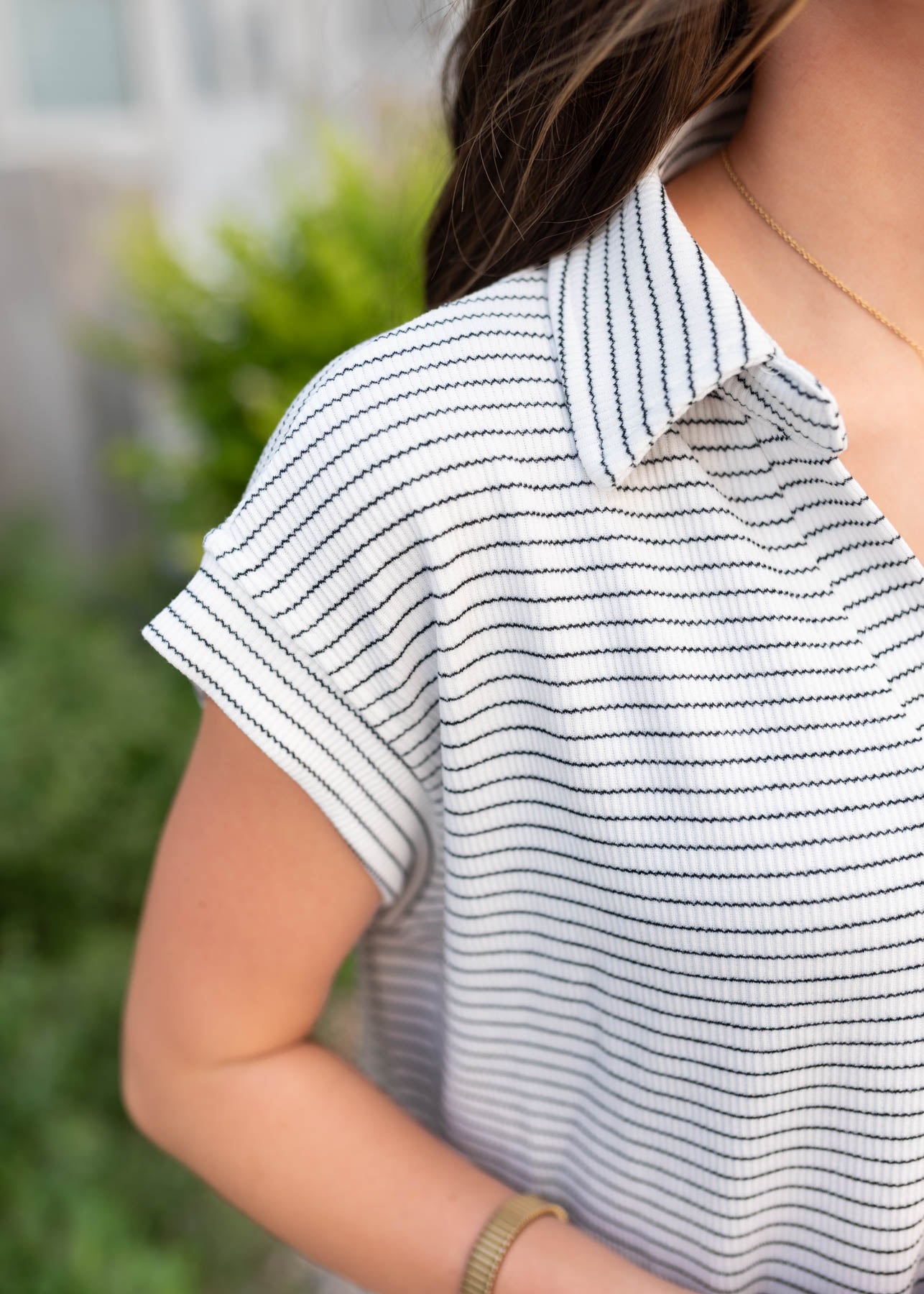 Close up of the sleeve on the black stripe dress