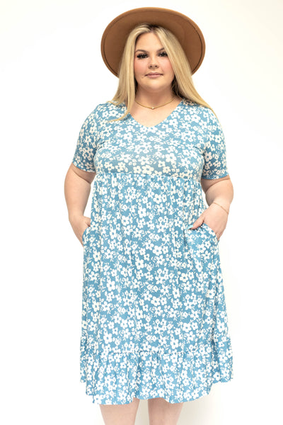 Front view of a plus size blue floral dress
