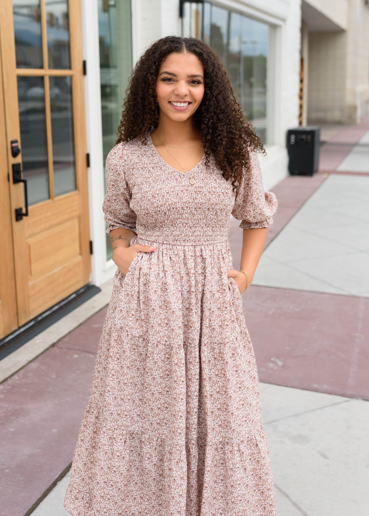 Modest V-neck dusty mauve floral dress with smocked bodice and tiered skirt