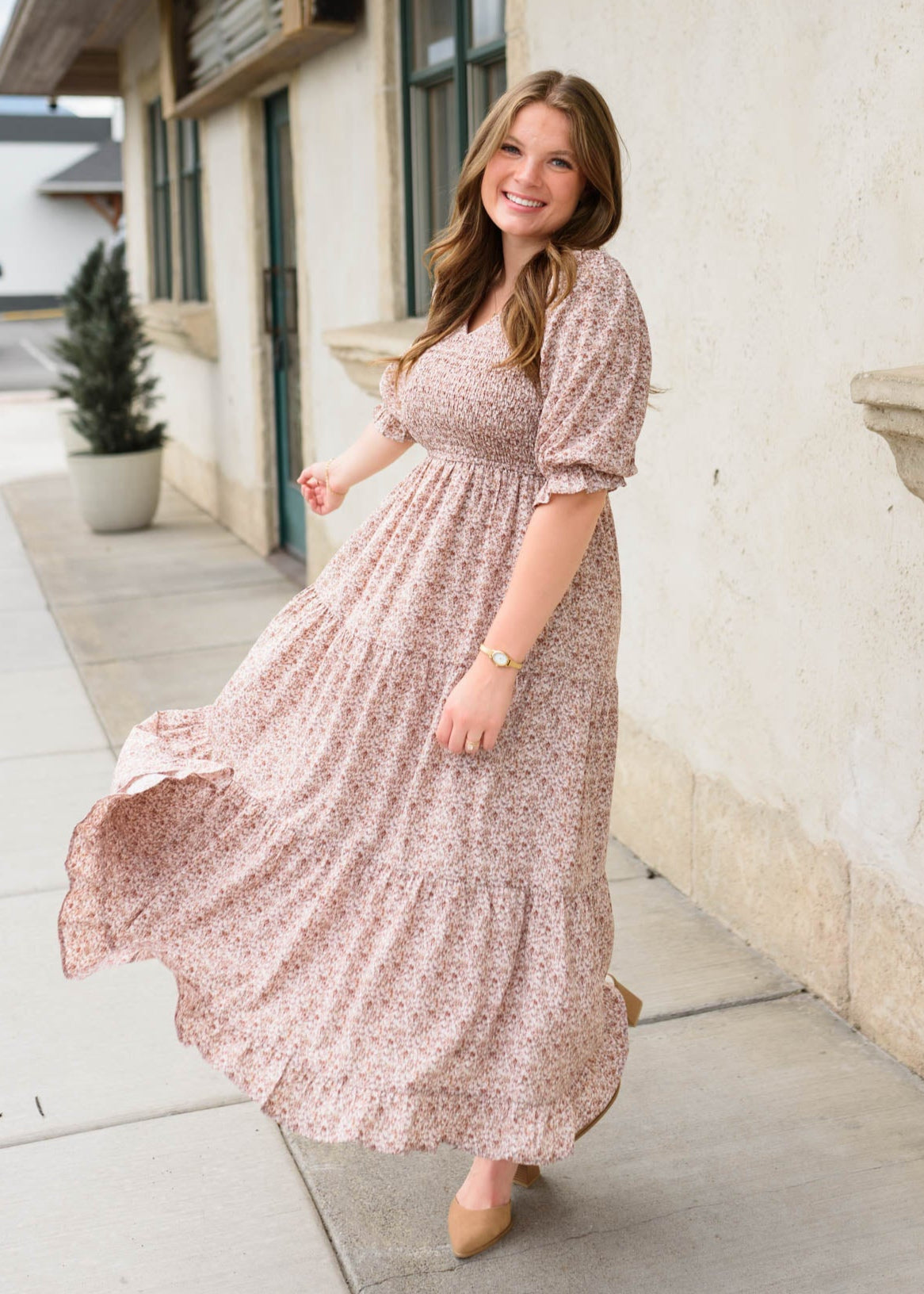 Side view of the dusty mauve floral dress with smocked bodice
