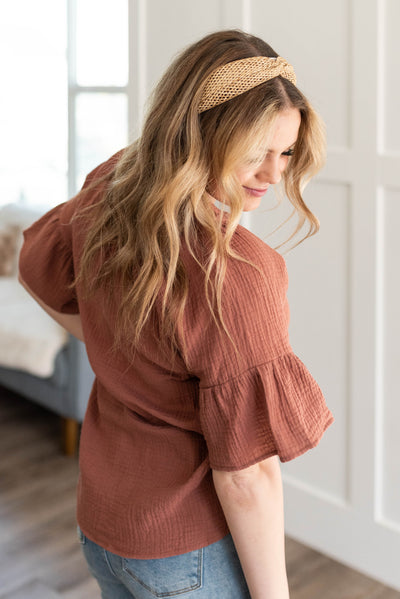 Side view of the terracotta blouse