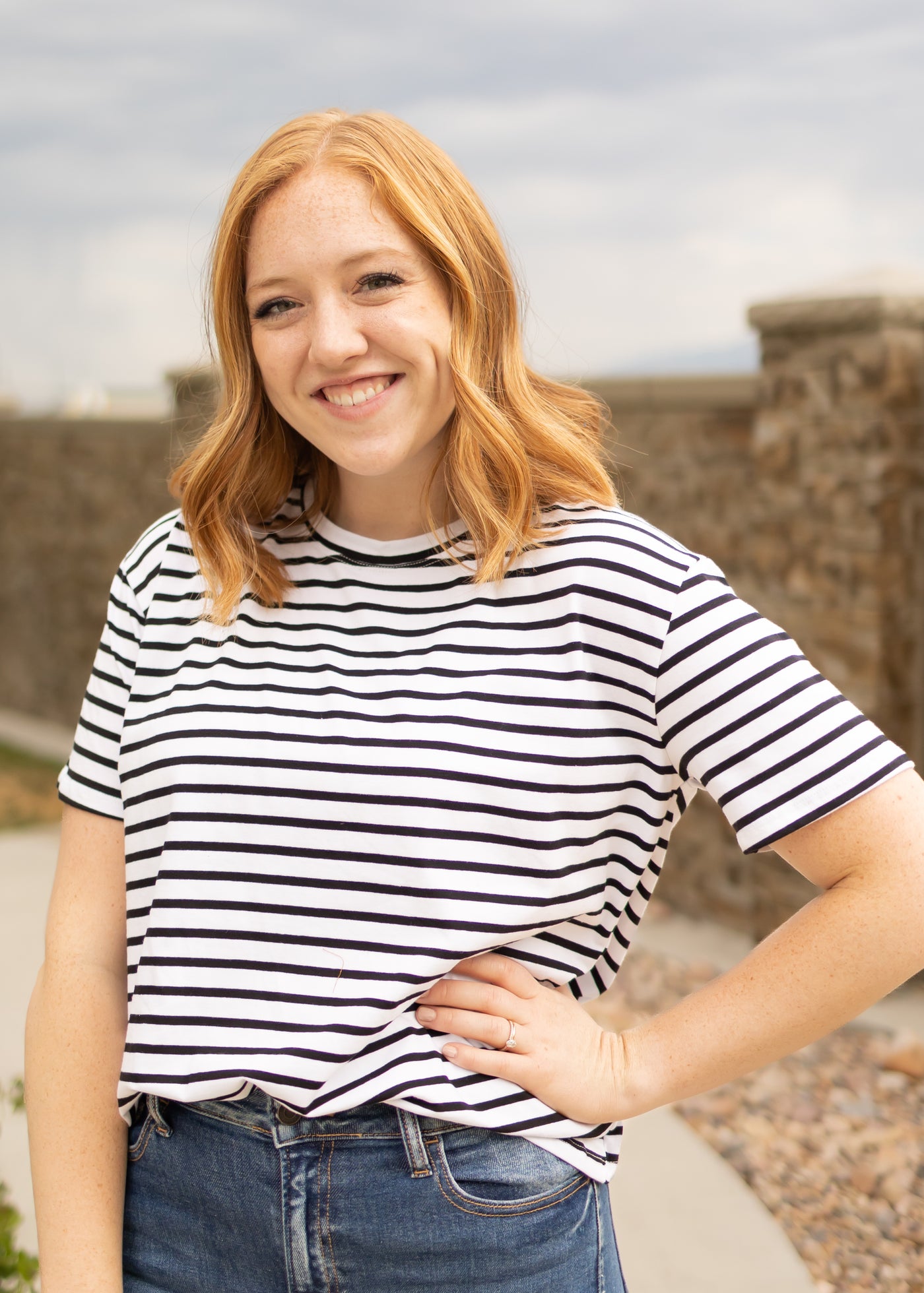 Front view of a short sleeve black top with stirpes