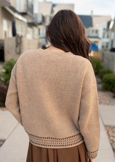 Back view of the tan pattern sweater