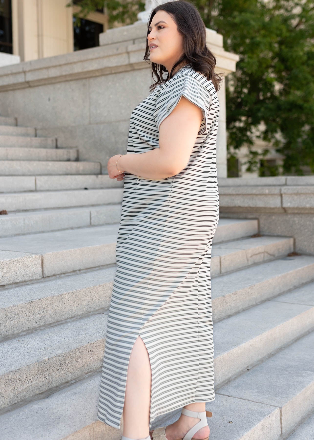 Side view of the black striped t-shirt dress in plus size