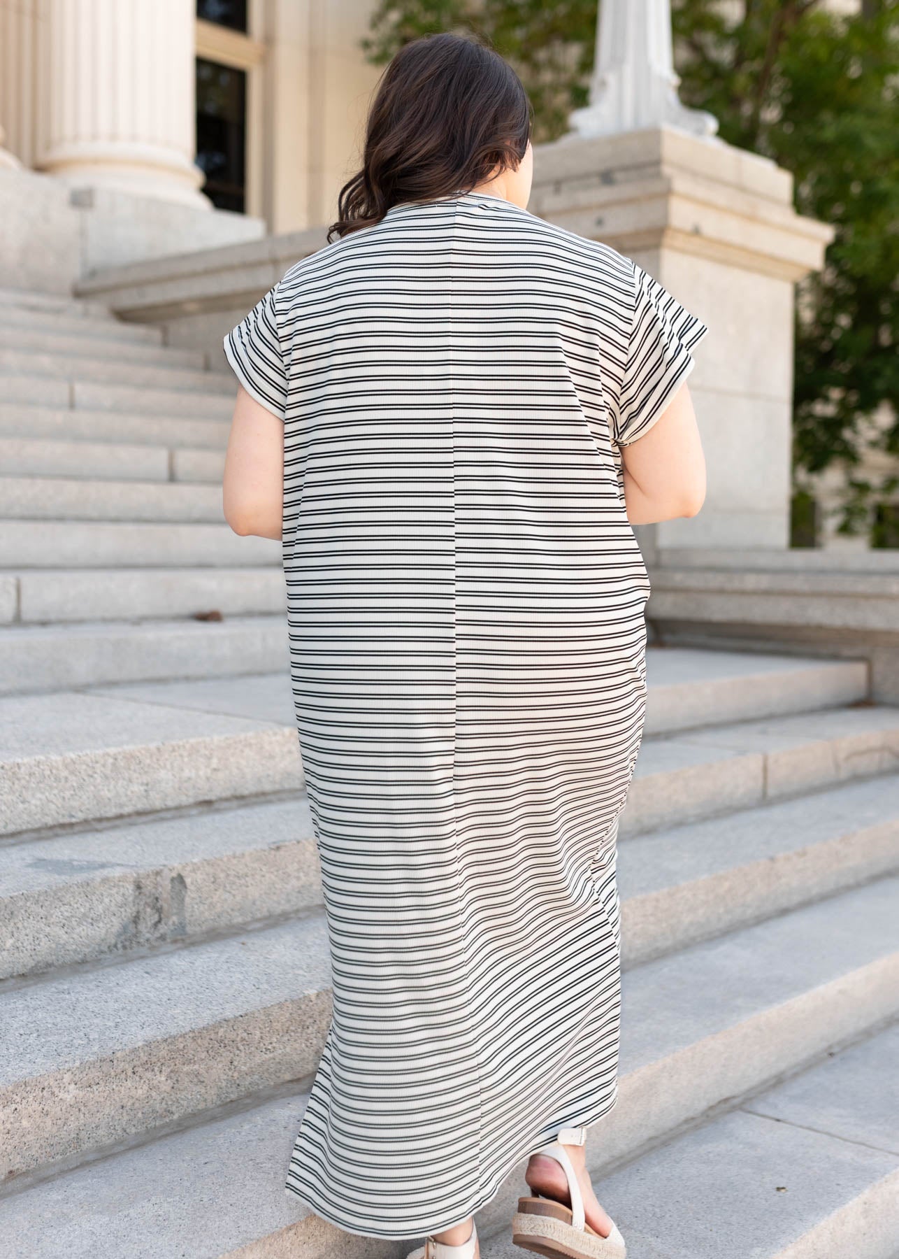 Back view of the black striped t-shirt dress in plus size