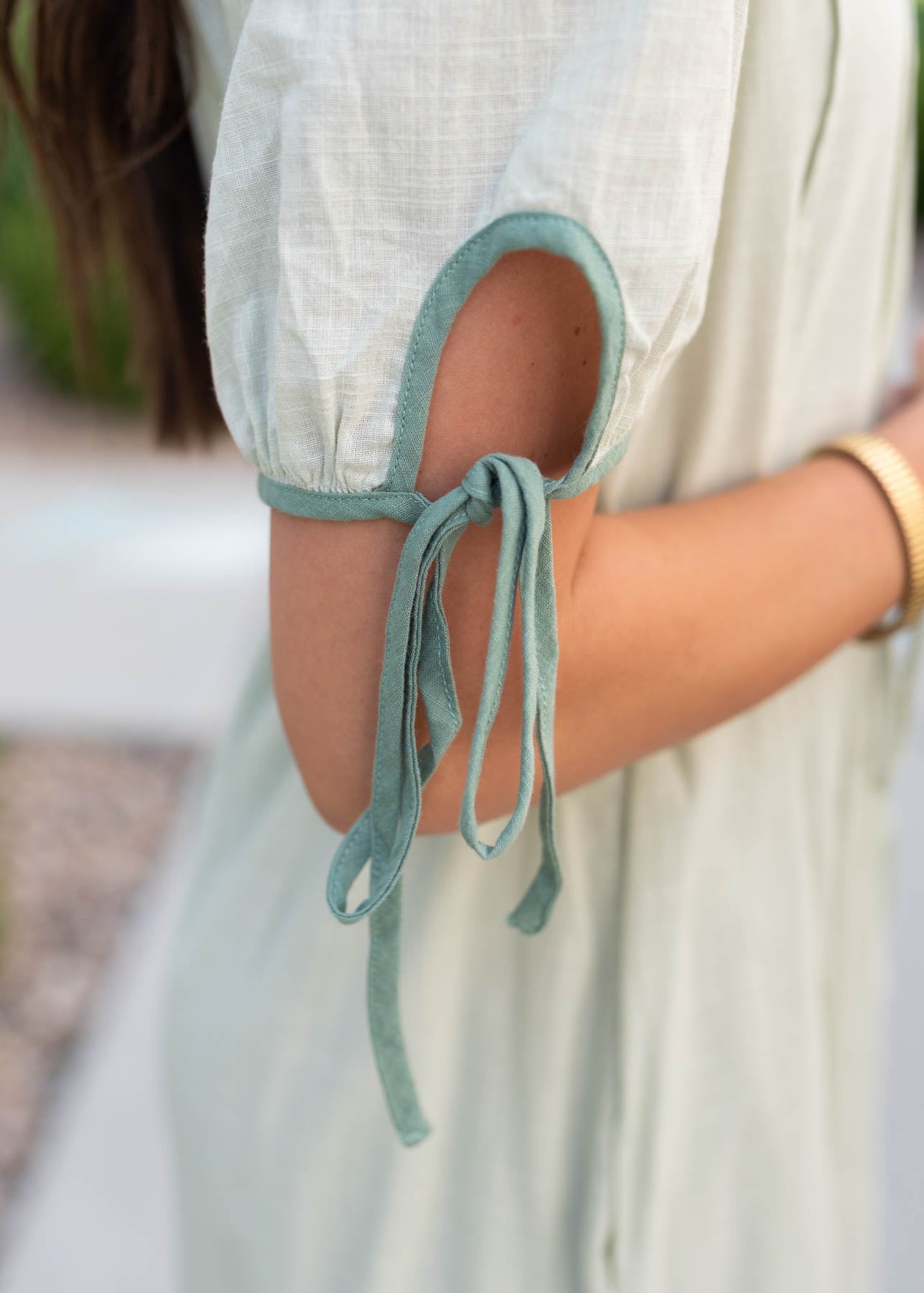 Close up of the sleeve detail on the sage dress