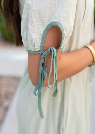 Close up of the sleeve detail on the sage dress