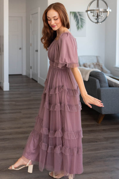 Side view of a dusty lavender maxi dress