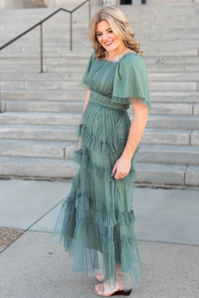 Side view of the dusty teal maxi dress with short sleeves