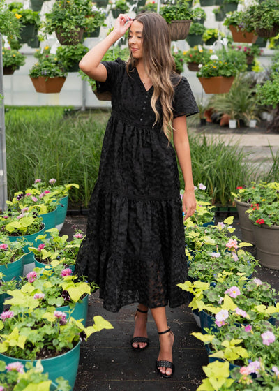 Black floral lace dress with buttons on the bodice