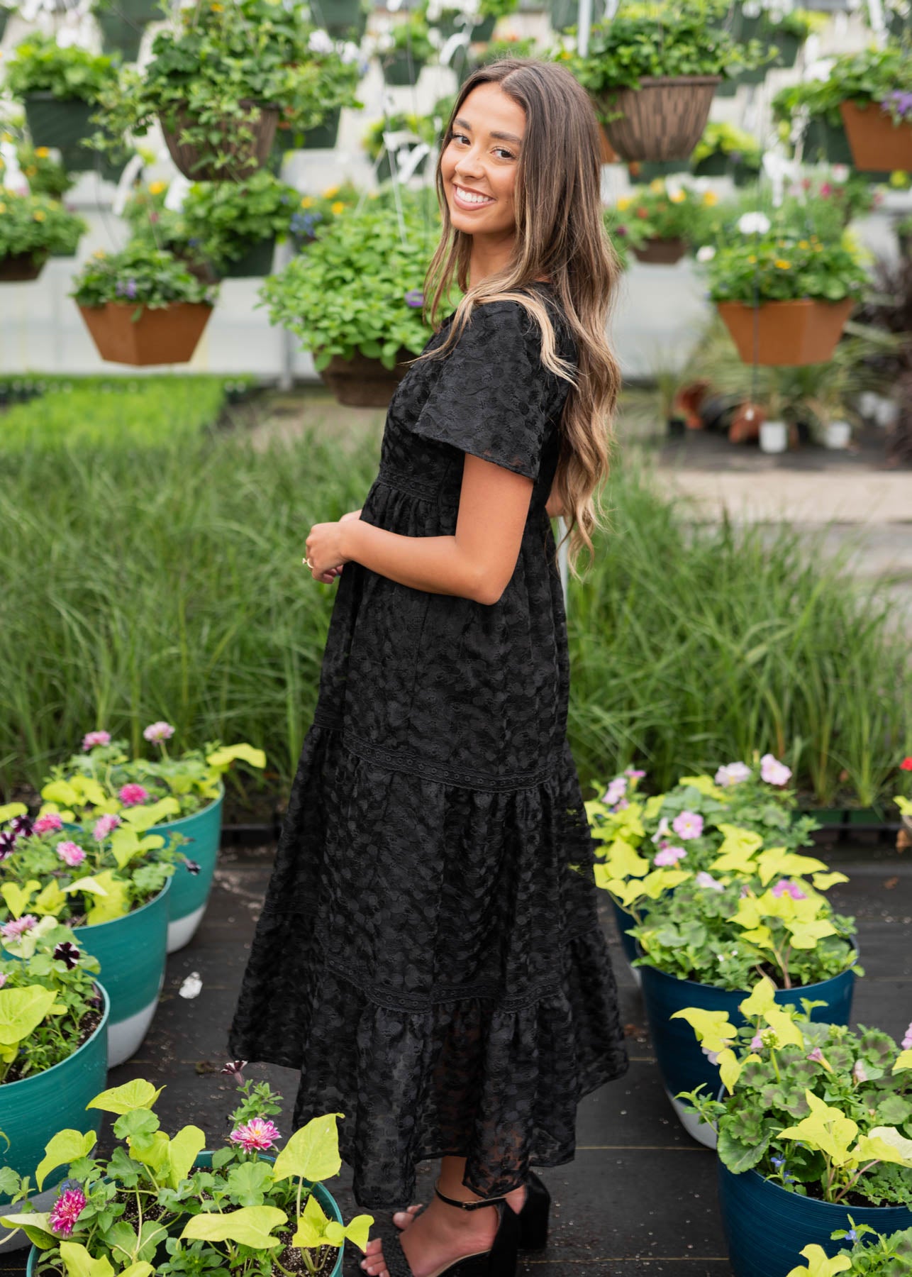 Side view of the black floral lace dress