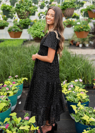 Side view of the black floral lace dress