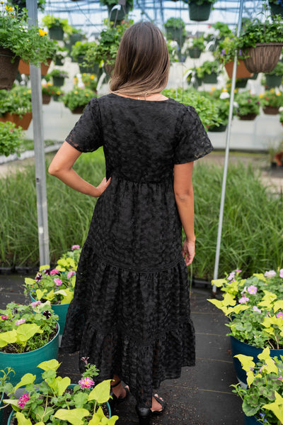Back view of the black floral lace dress