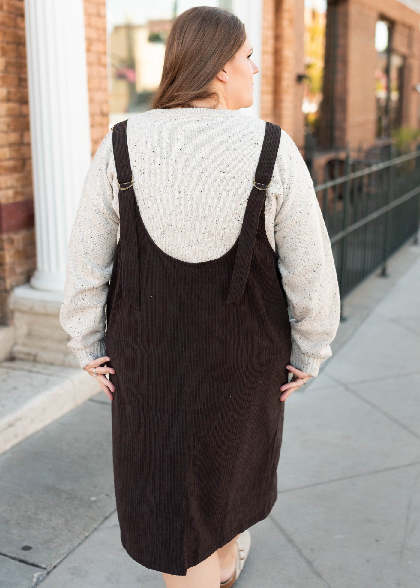 Back view of the brown corduroy overall dress in plus size