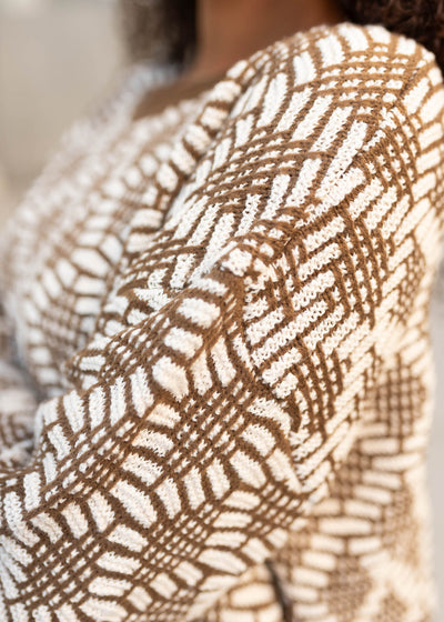 Close up of the pattern on the brown pattern sweater