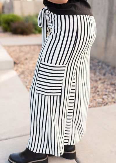 Side view of the black stripe pants with side pockets