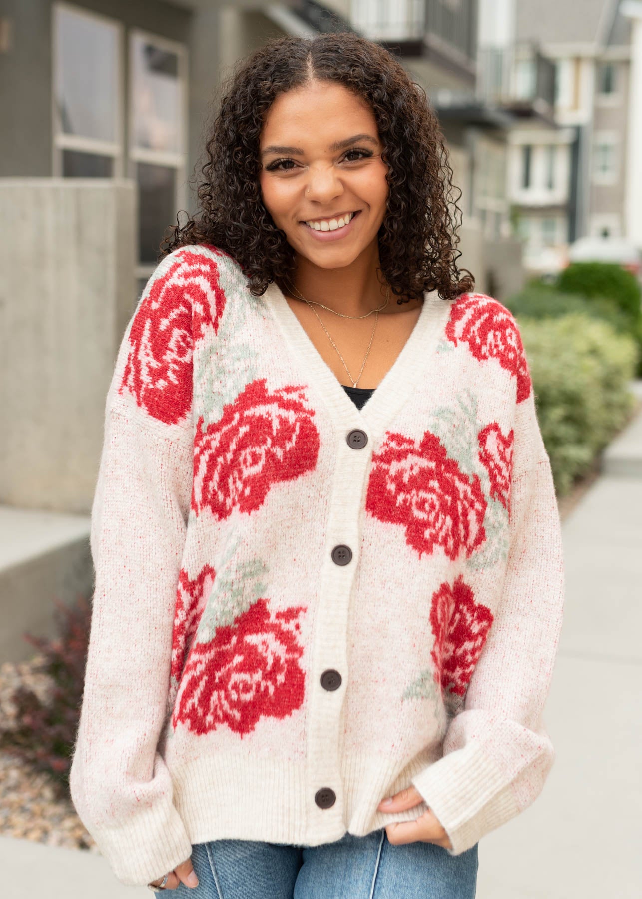 Modest red floral cardigan with long sleeves and dark brown buttons