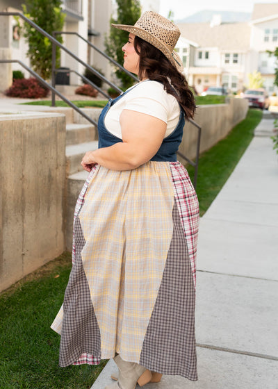 Side view of the denim patchwork plaid overall dress in plus size