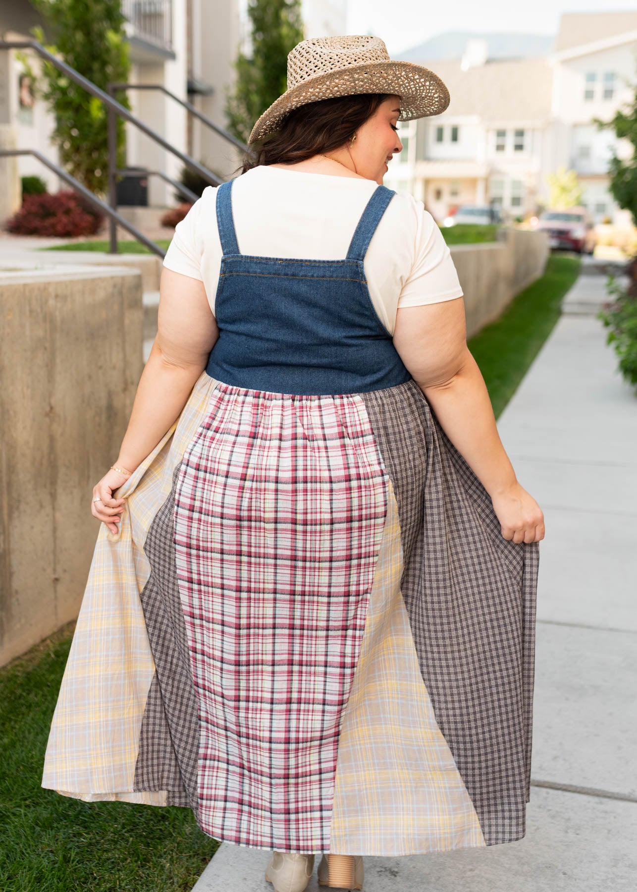 Back view of the plus size denim patchwork plaid overall dress