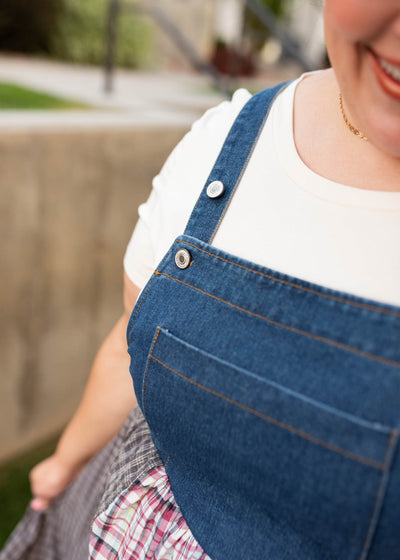 Close up of the buttons on the plus size denim patchwork plaid overall dress