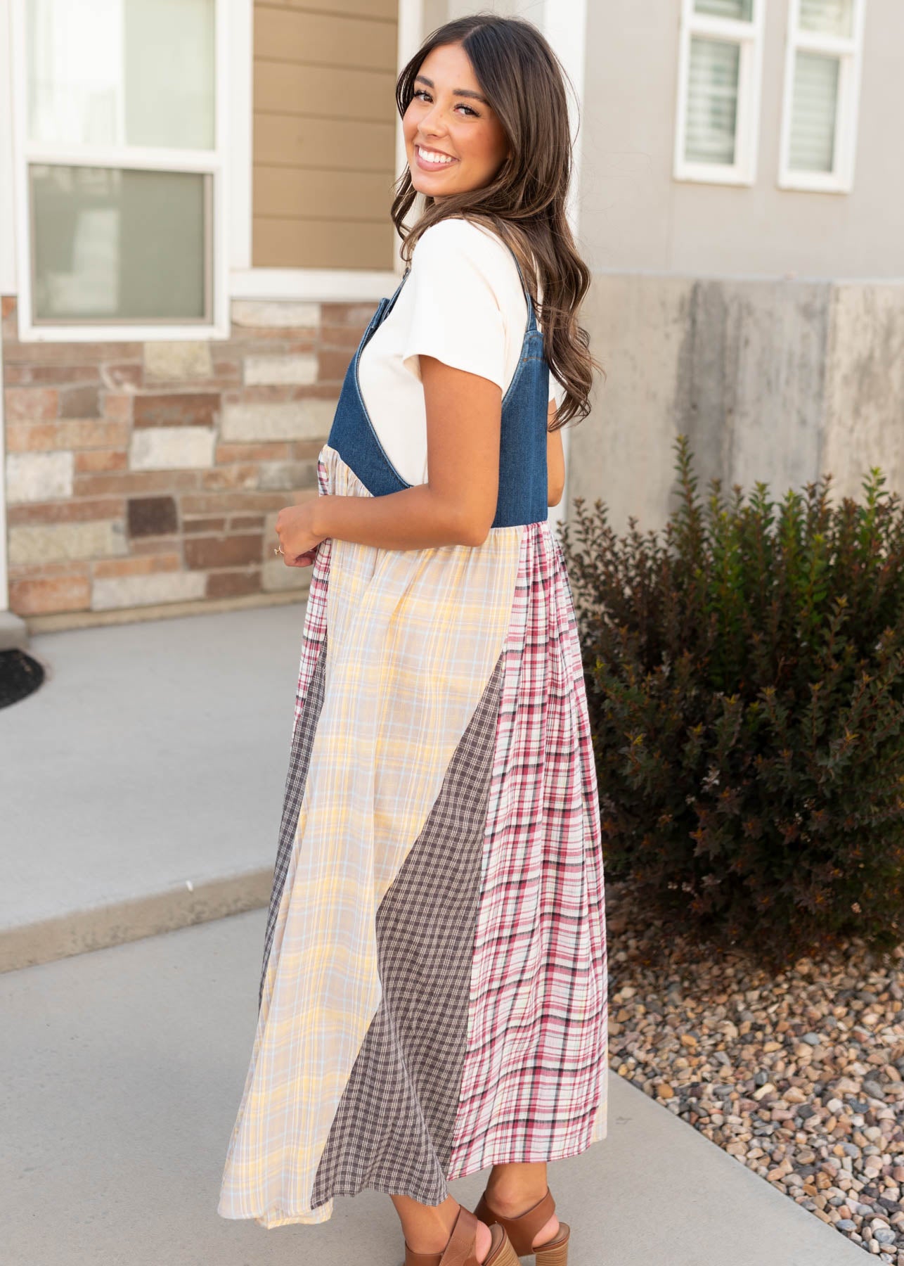 Side view of the modest denim patchwork plaid overall dress