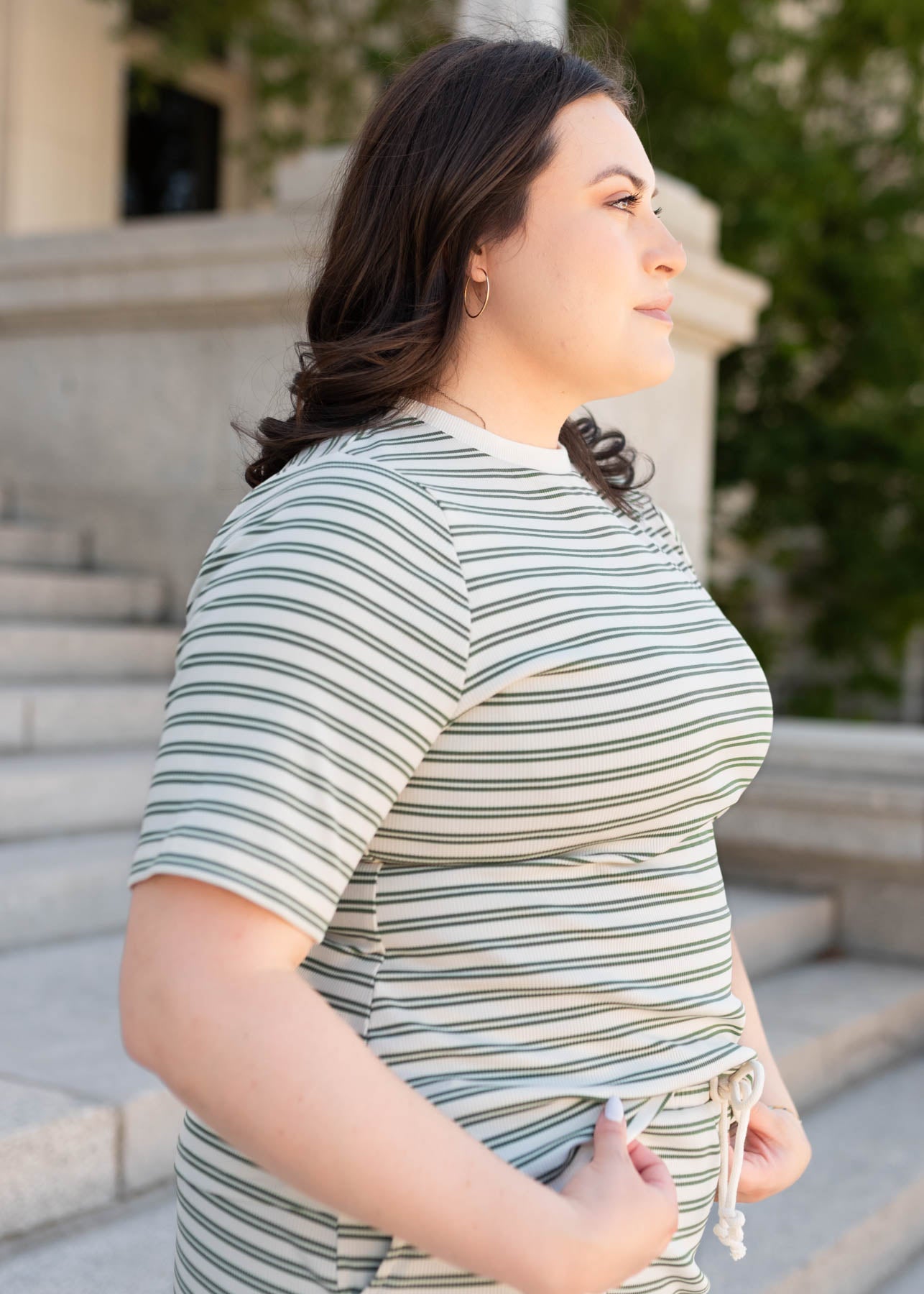 Plus size side view of the green striped top