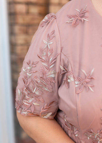 Close up of the sleeve and fabric on the blush floral dress