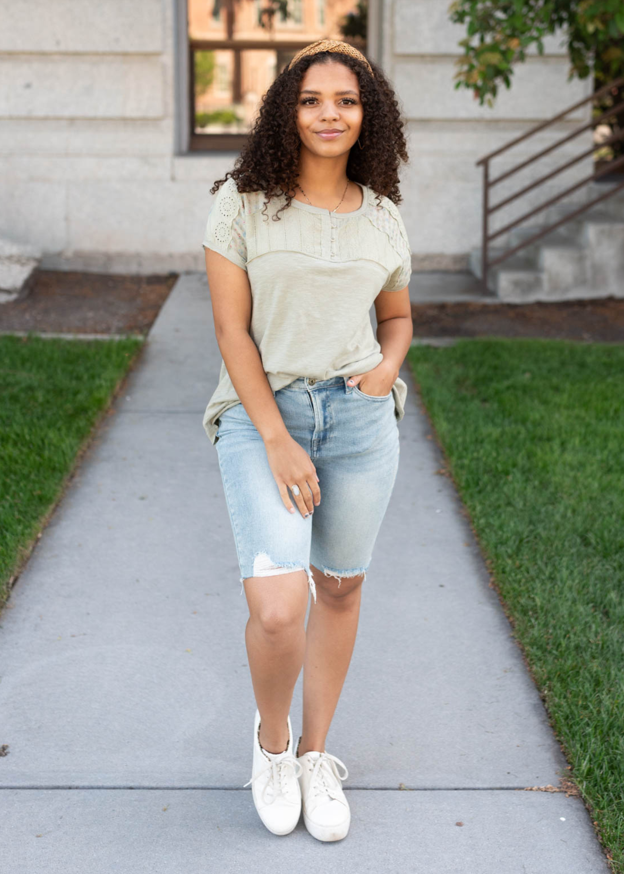 Moss green floral top with short sleeves and fabric panel. 