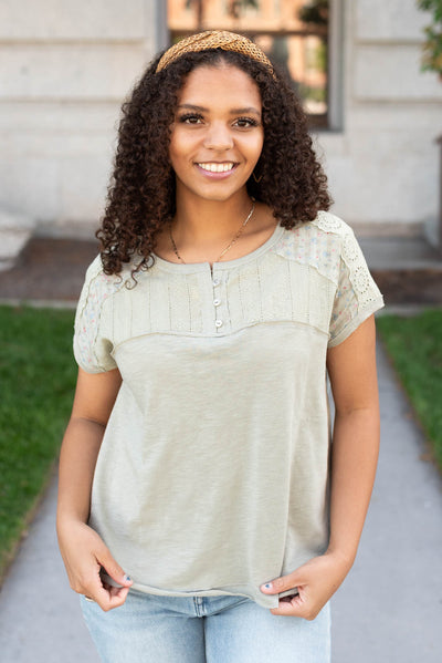 Short sleeve moss green floral top with three buttons