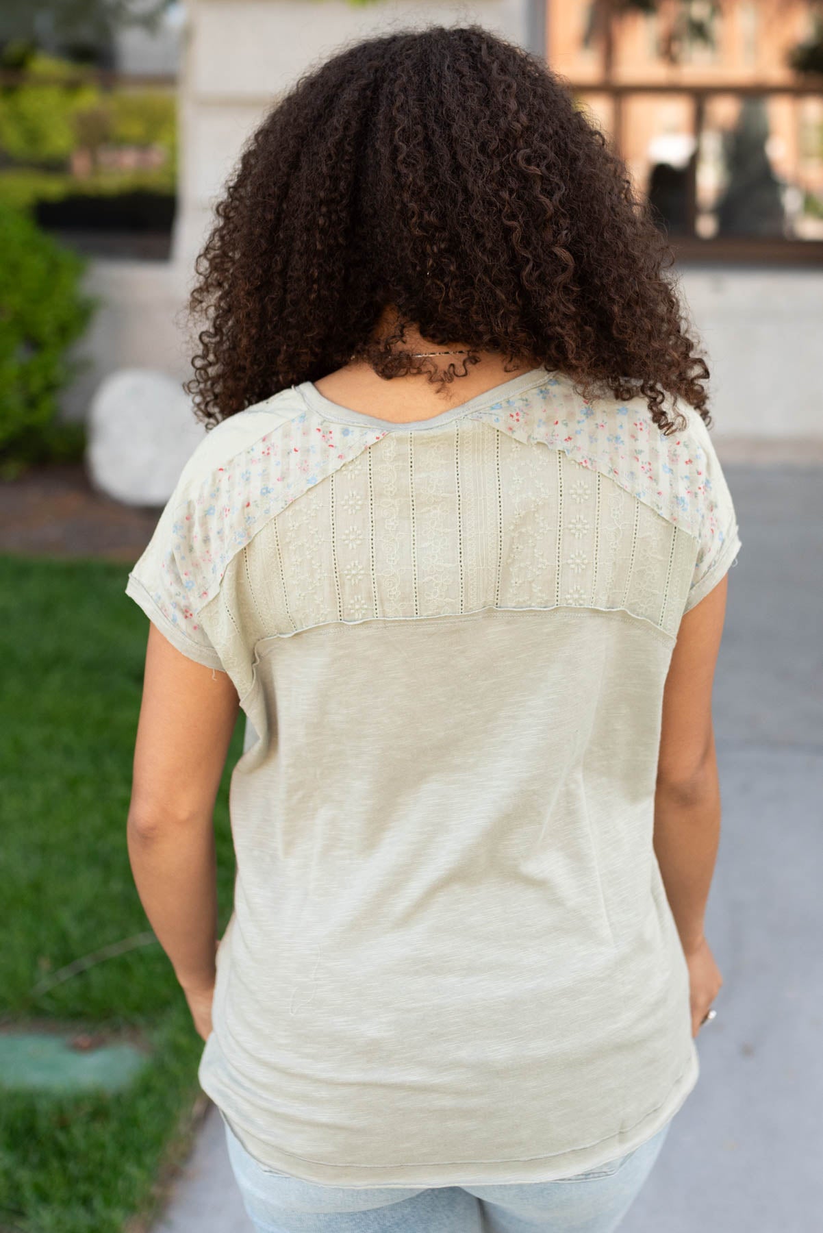 Back view of the moss green floral top