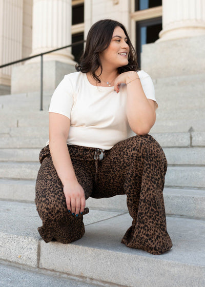 Wide leg leopard print pants in plus size with a tie at the waist